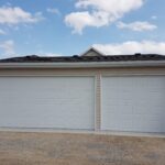 Custom detached garage built by V AAR Exteriors in Calgary with durable siding and roofing